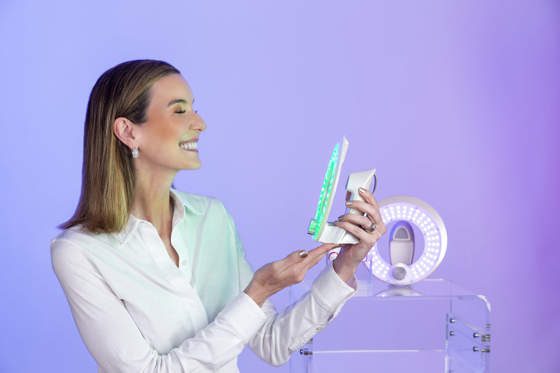 Board-certified dermatologist Dr. Ellen Marmur holding MMSphere Luxe handheld LED light therapy device for green light therapy treatment.